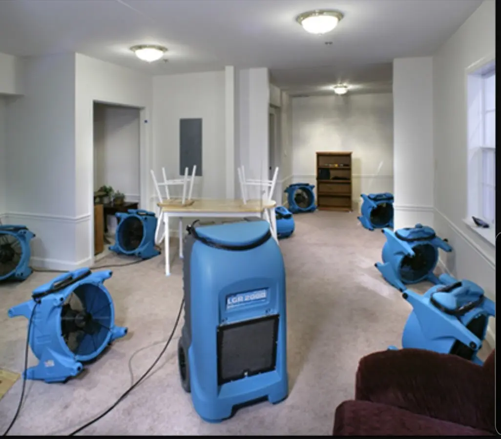 Air movers and dehumidifier setup for Water Damage Restoration in Marengo